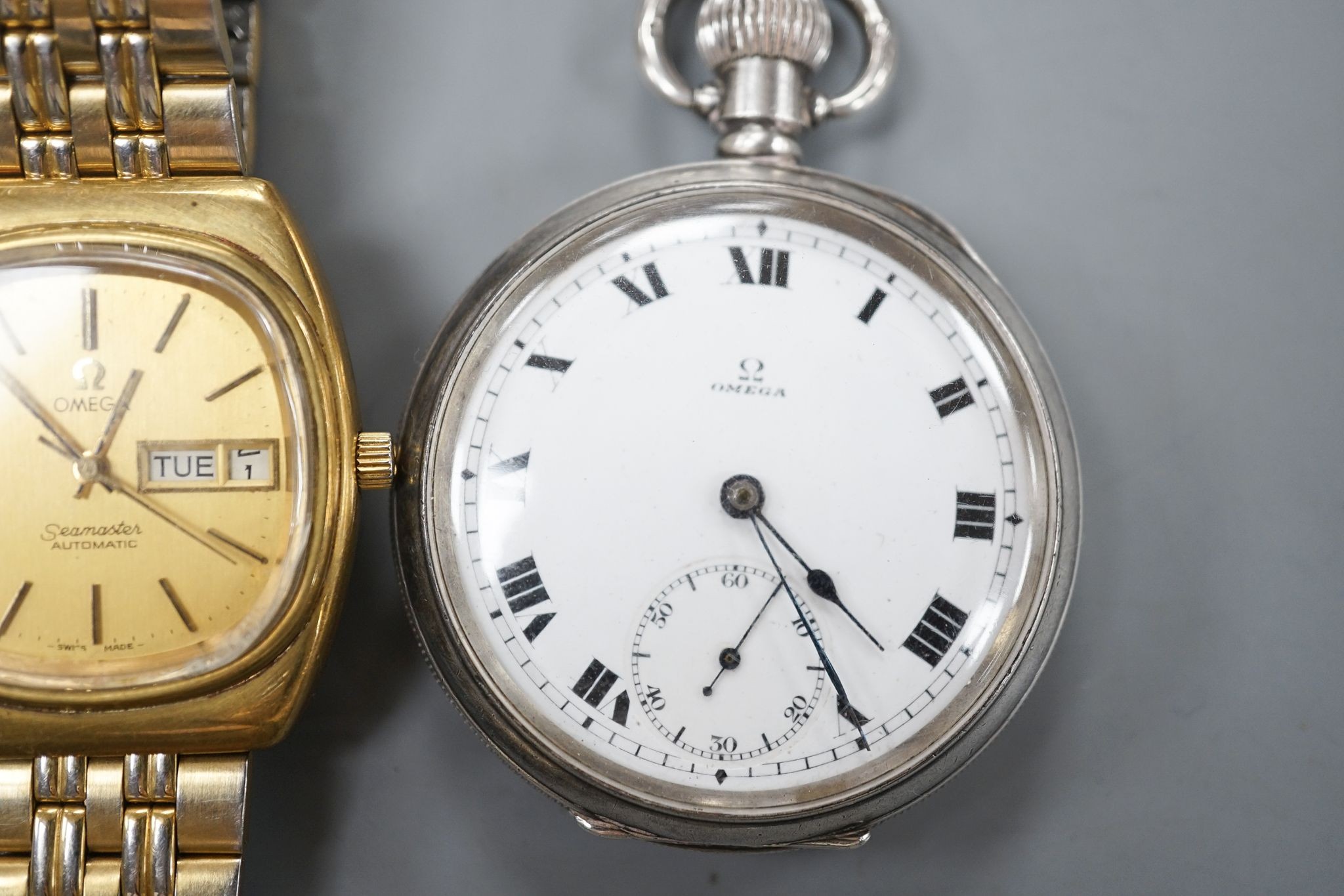 A George V silver Omega open face keyless pocket watch and a gold plated Omega Seamaster day/date automatic wrist watch.
